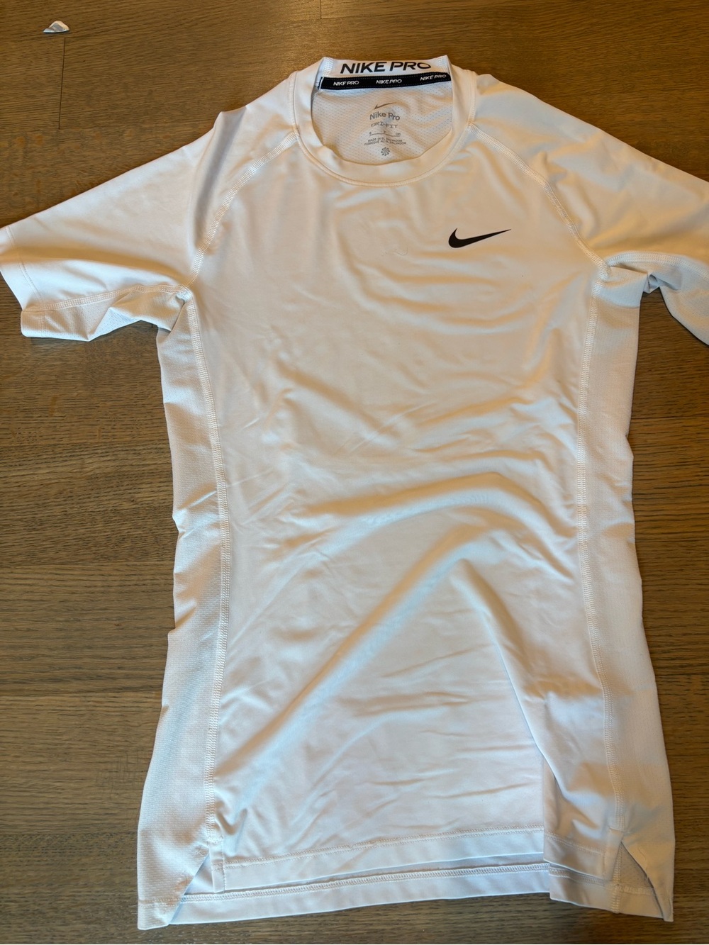 Nike White Short-Sleeve Performance Tee with Black Swoosh